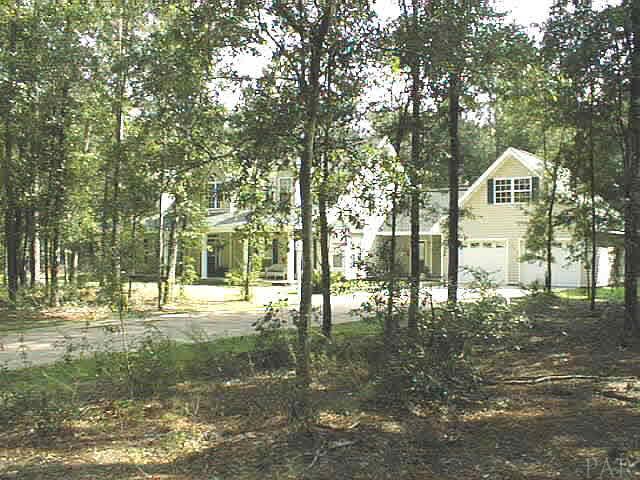 5965 Clark Road Milton, FL 32570 - Photo 1 of 16 a view of a town with large trees