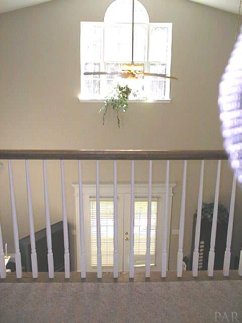 5965 Clark Road Milton, FL 32570 - Photo 6 of 16 a view of staircase with wooden floor