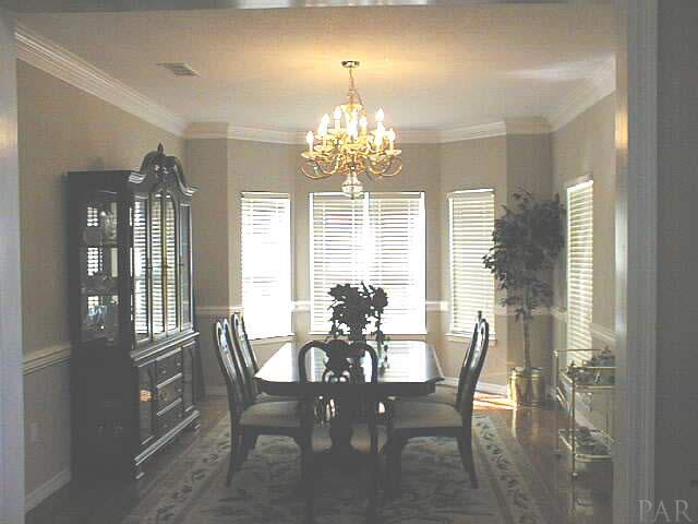 5965 Clark Road Milton, FL 32570 - Photo 8 of 16 a dining room with furniture and window