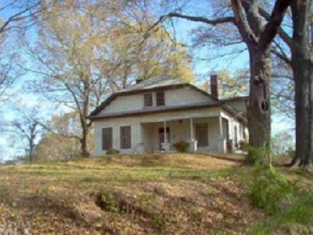 16 Stevens Street Rome, GA 30161 - Photo 1 of 1 a front view of house with yard and trees around