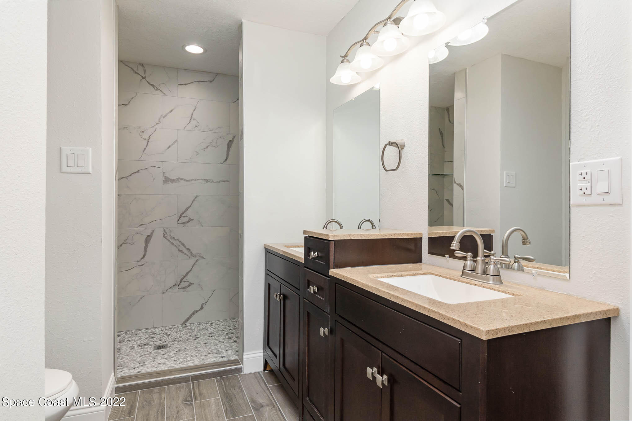 2380 Friday Road Cocoa, FL 32926 - Photo 15 of 30 a bathroom with a sink a toilet and shower