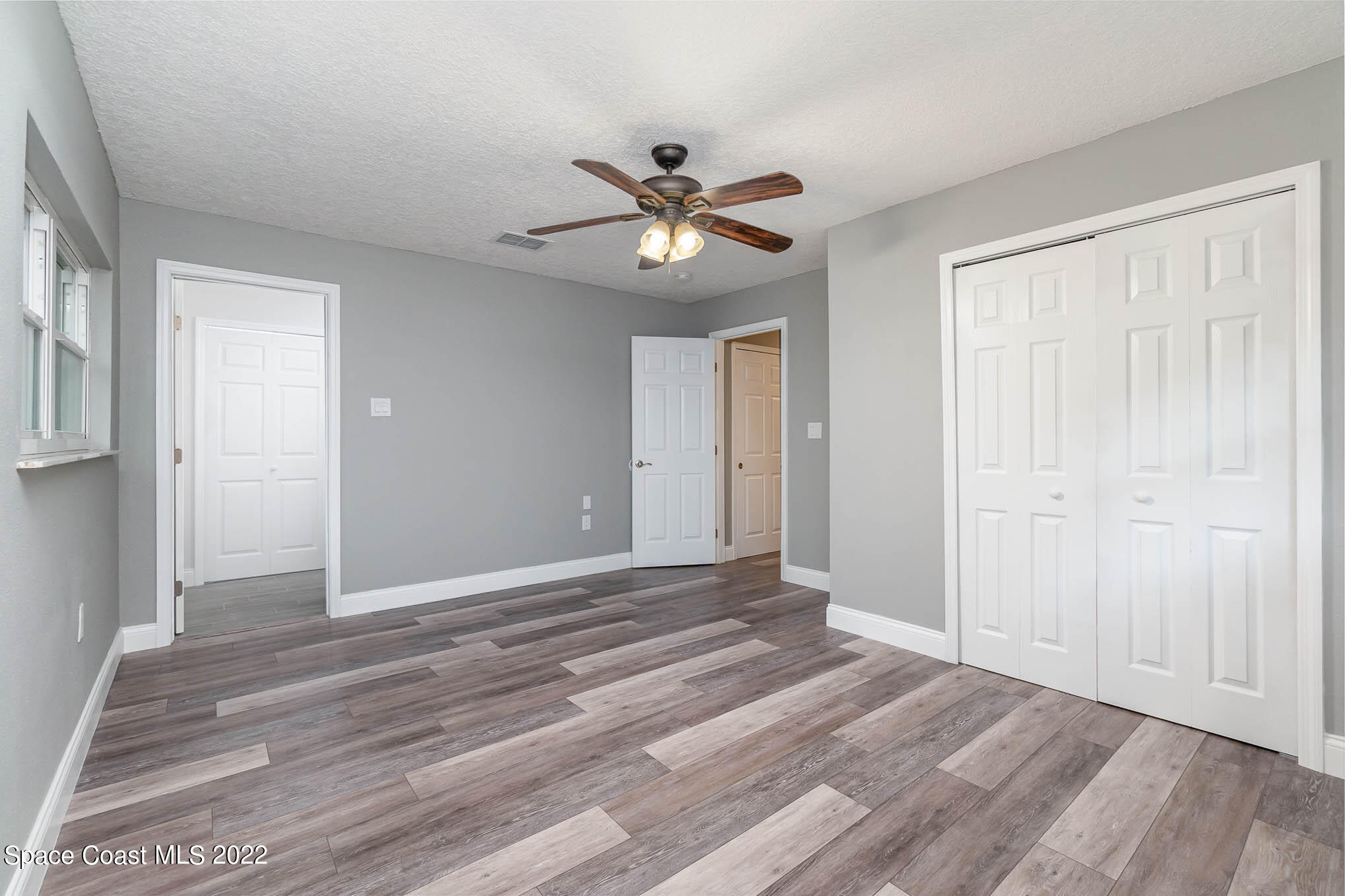 2380 Friday Road Cocoa, FL 32926 - Photo 17 of 30 a view of a livingroom with a chandelier fan