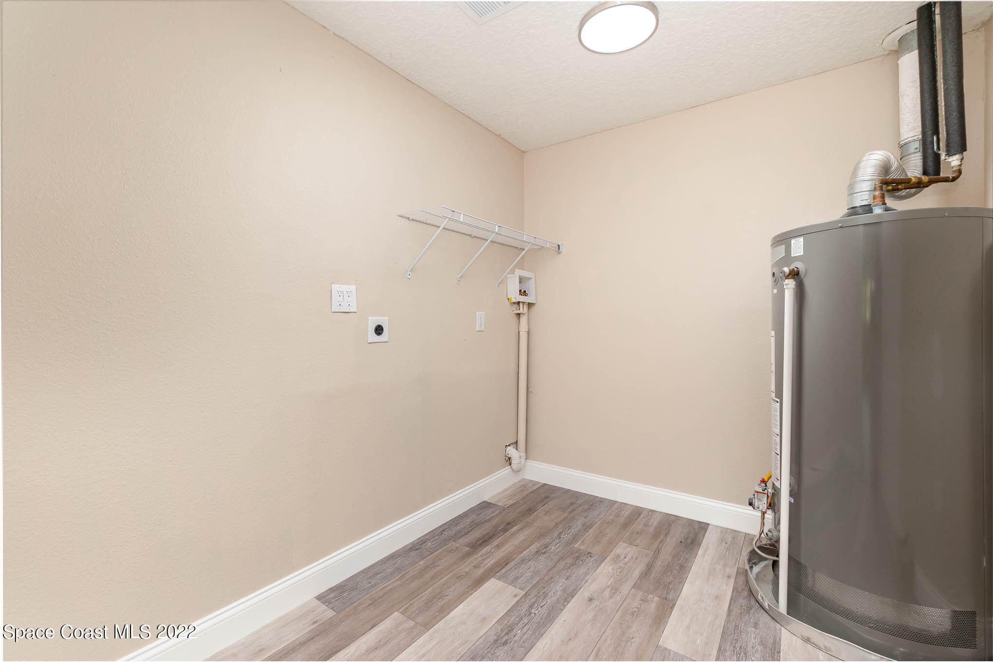 2380 Friday Road Cocoa, FL 32926 - Photo 23 of 30 a view of a room with wooden floor