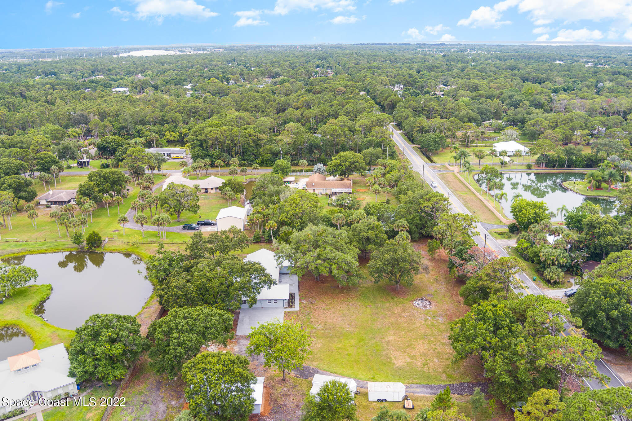 2380 Friday Road Cocoa, FL 32926 - Photo 29 of 30 an aerial view of residential houses with outdoor space and trees