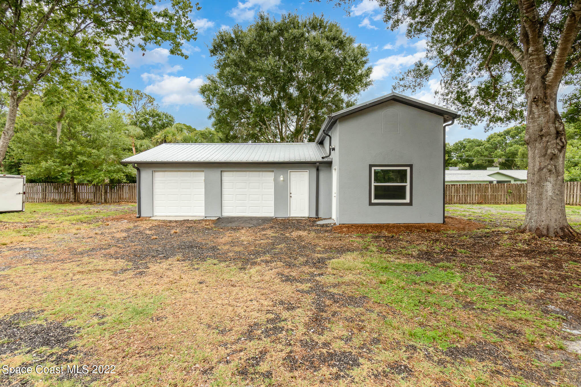 2380 Friday Road Cocoa, FL 32926 - Photo 4 of 30 a house with yard in front of it