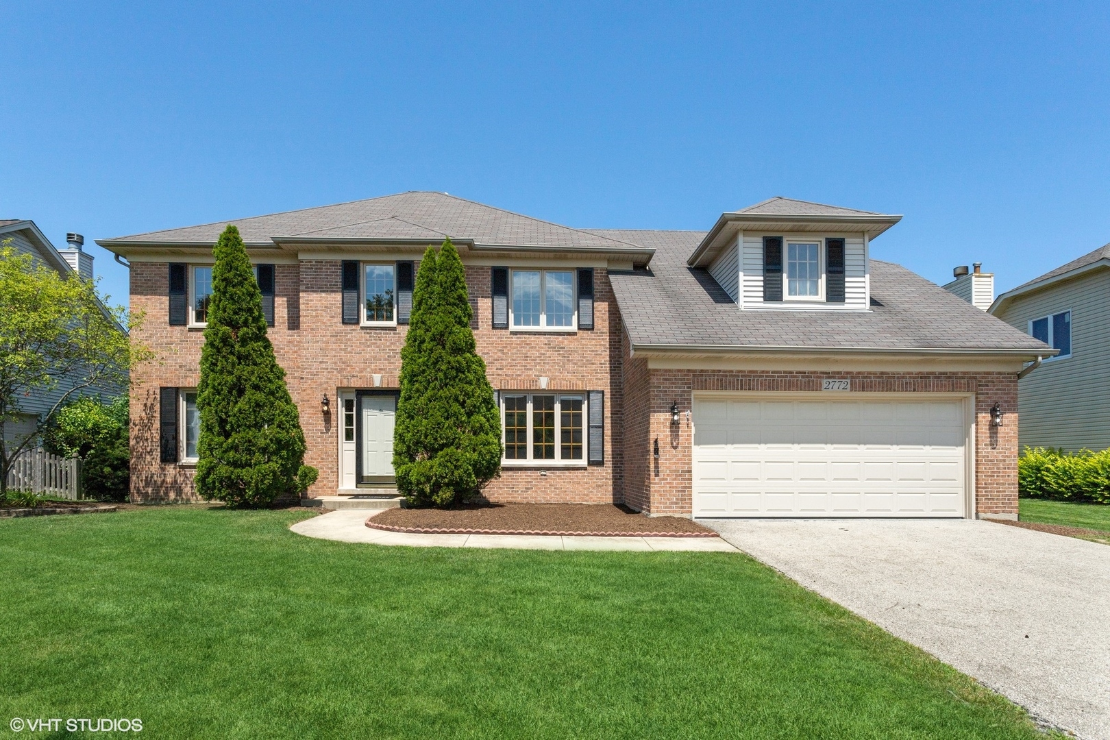 2772 Freeland Circle Naperville, IL 60564 - Photo 1 of 33 a front view of a house with a yard and garage