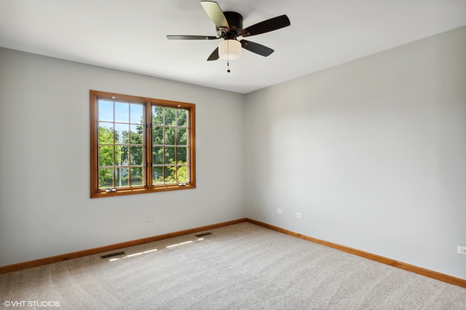 2772 Freeland Circle Naperville, IL 60564 - Photo 19 of 33 an empty room with a window and a ceiling fan