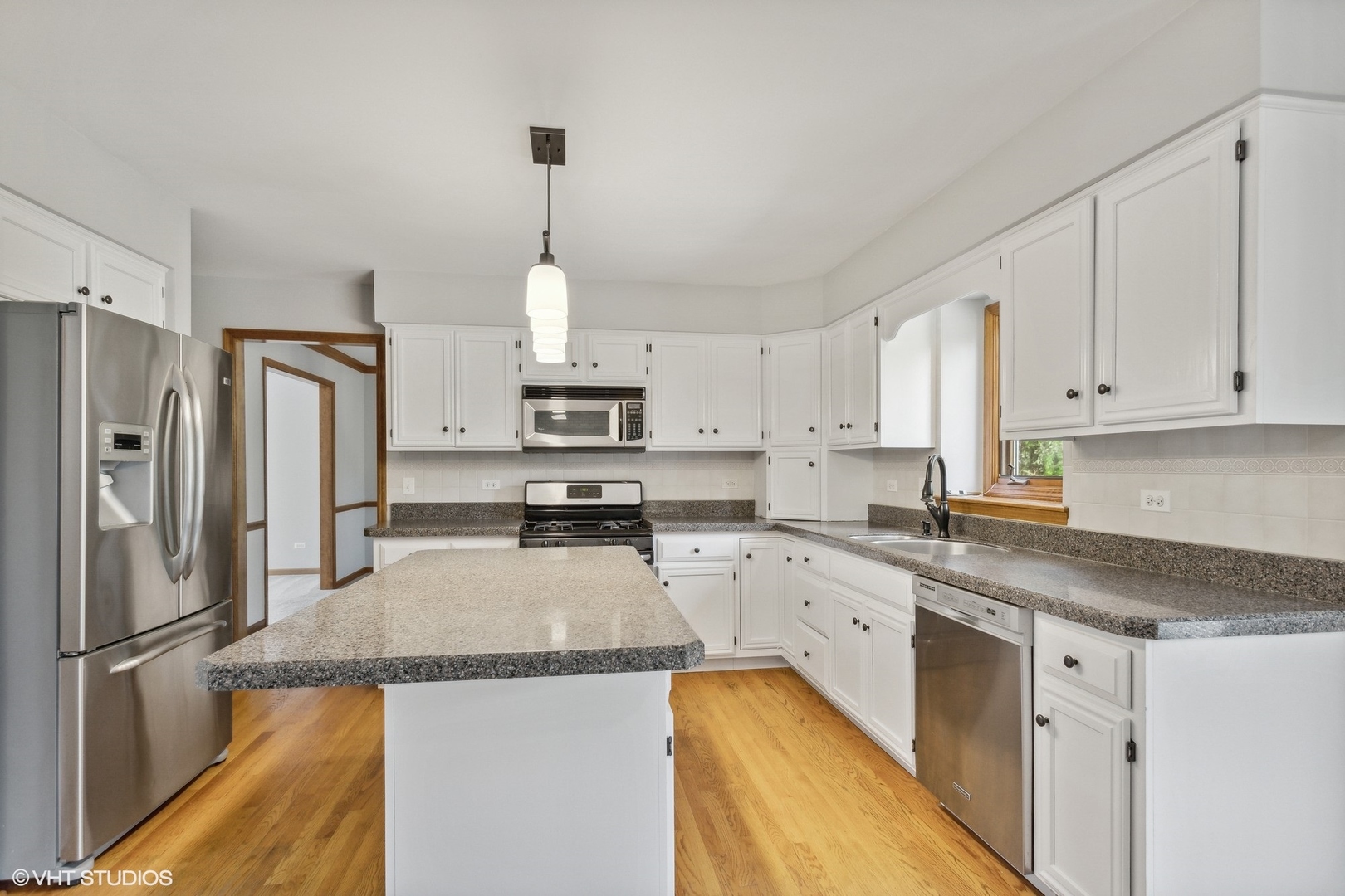 2772 Freeland Circle Naperville, IL 60564 - Photo 6 of 33 a kitchen with stainless steel appliances granite countertop a refrigerator a sink a stove and white cabinets
