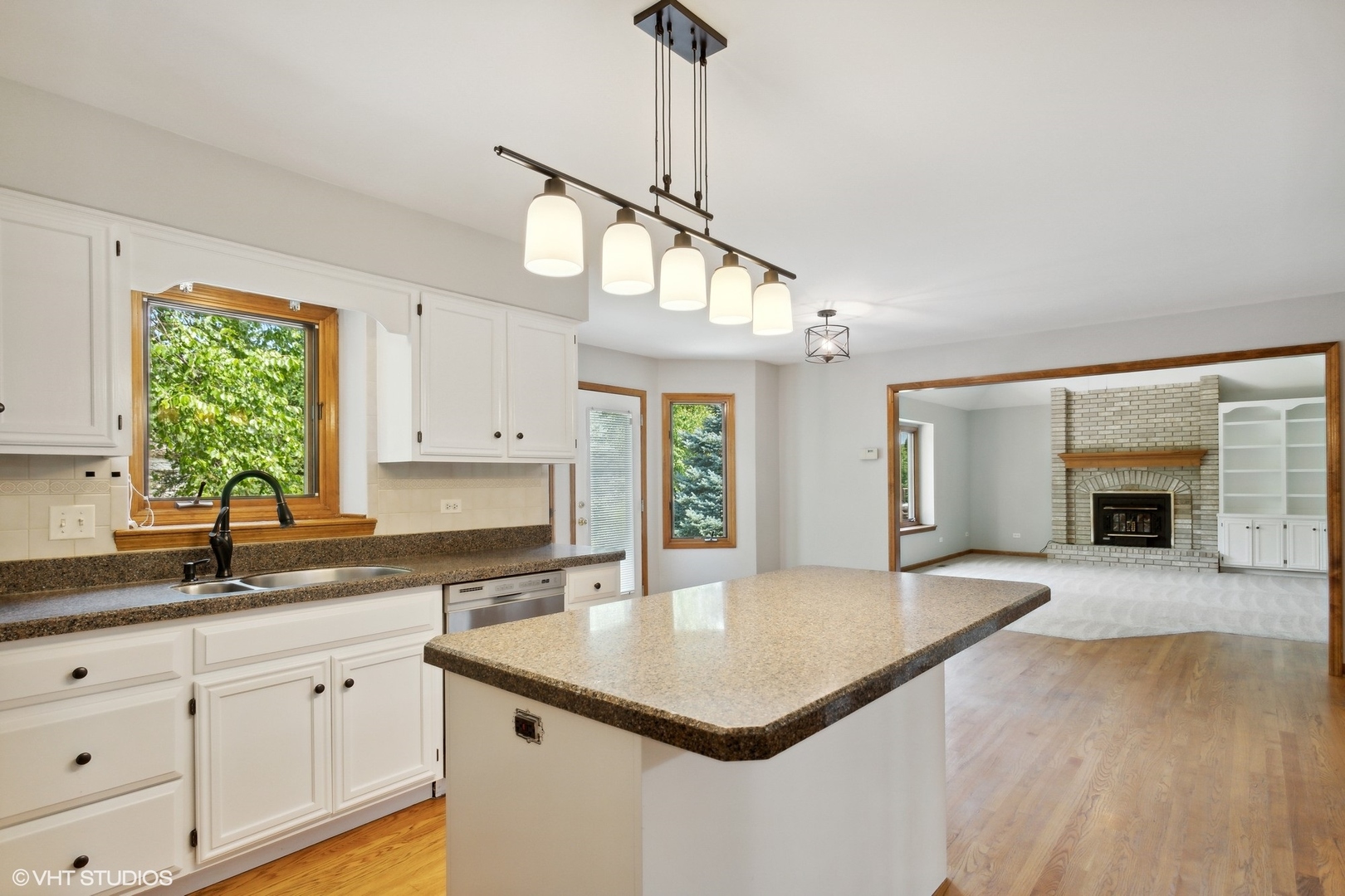 2772 Freeland Circle Naperville, IL 60564 - Photo 7 of 33 a kitchen with granite countertop a sink cabinets and window