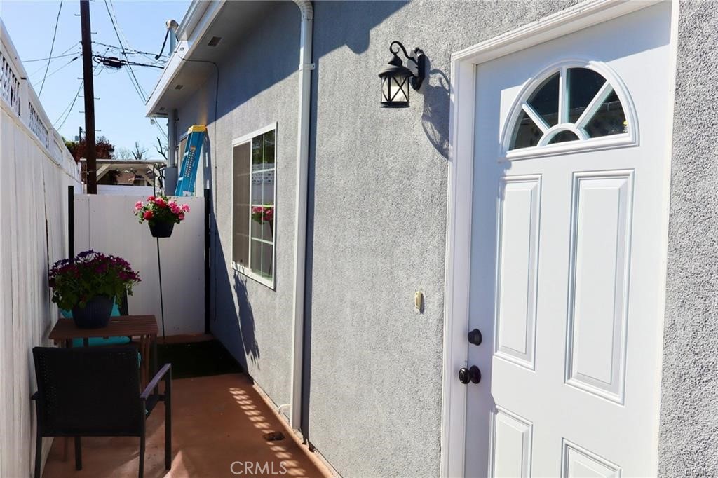 a front view of a house with sitting area