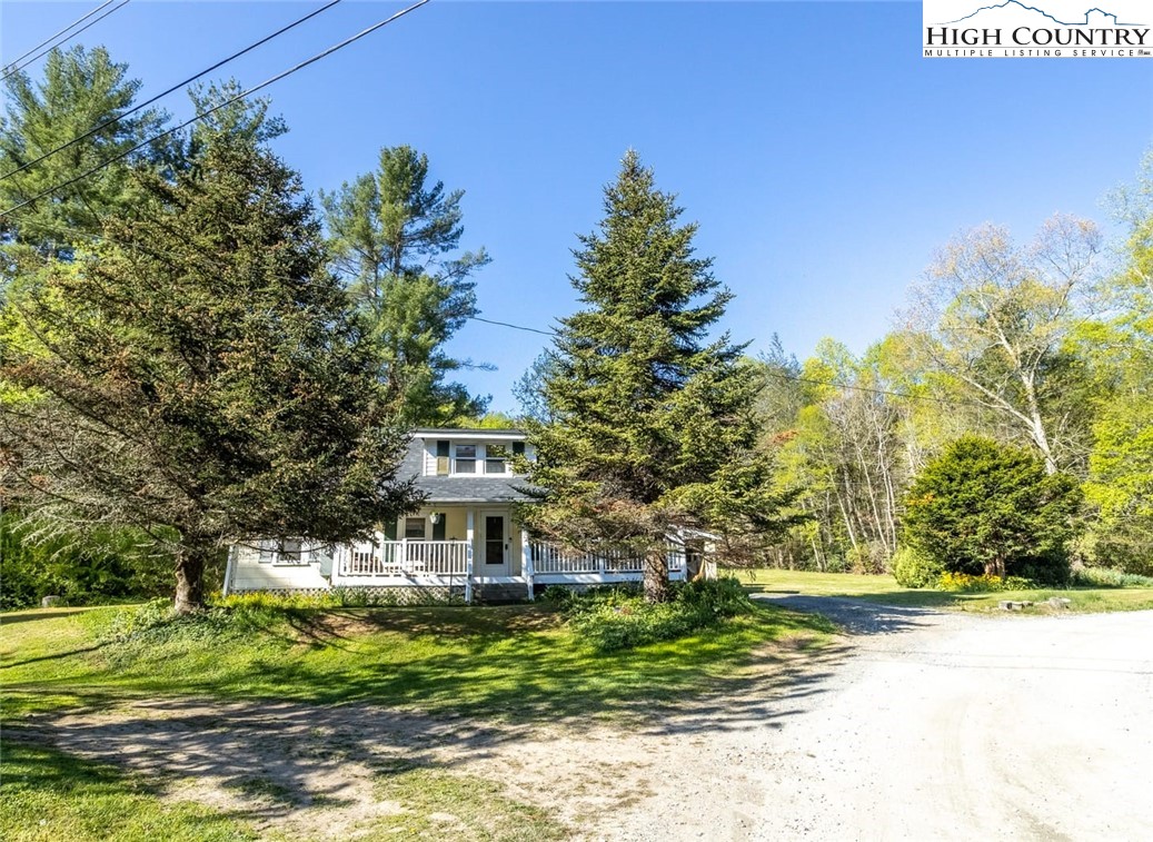 165 V L Moretz Road Deep Gap, NC 28618 - Photo 13 of 38 a front view of a house with a yard