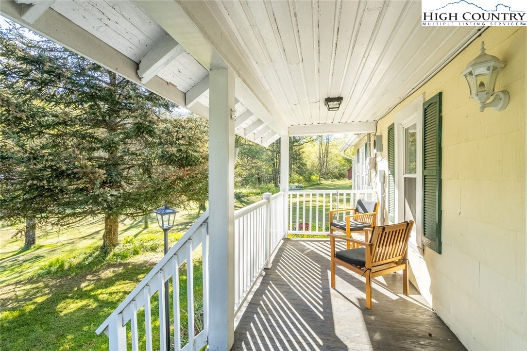 165 V L Moretz Road Deep Gap, NC 28618 - Photo 2 of 38 a view of balcony with wooden floor