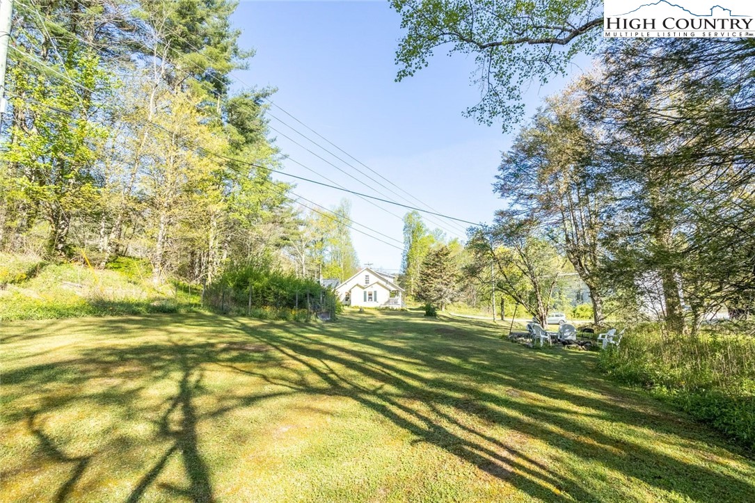 165 V L Moretz Road Deep Gap, NC 28618 - Photo 10 of 38 a view of a yard with basketball court