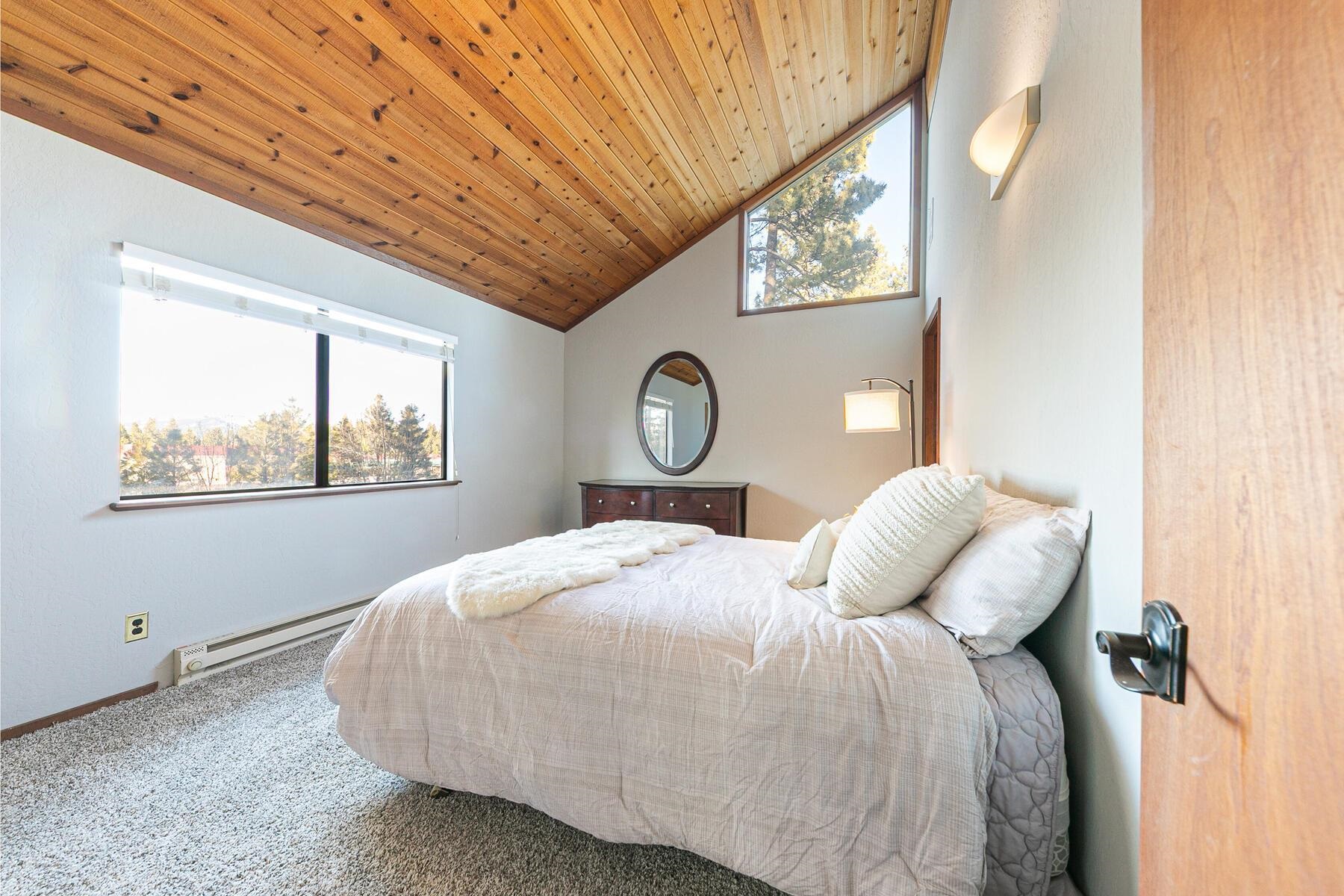 10806 Manchester Drive Truckee, CA 96161 - Photo 20 of 28 a bedroom with bed and a window