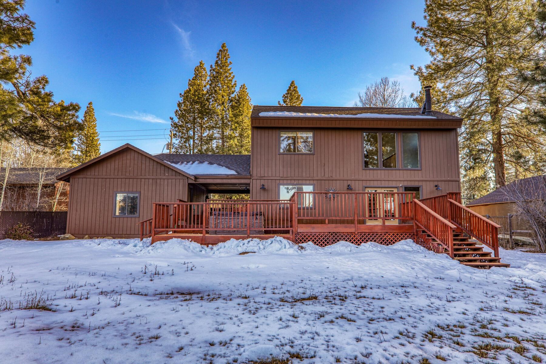 10806 Manchester Drive Truckee, CA 96161 - Photo 2 of 28 a view of a house with a yard covered in snow