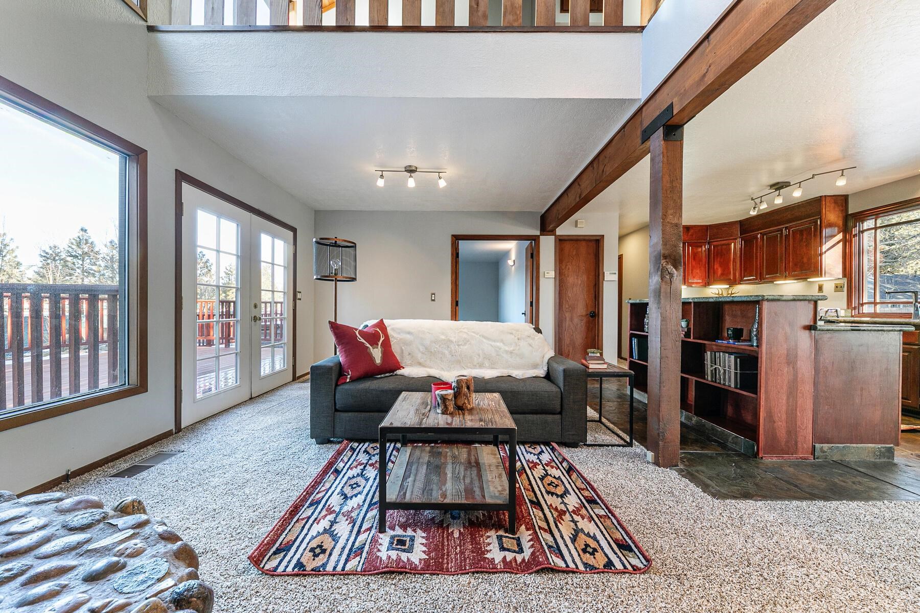 10806 Manchester Drive Truckee, CA 96161 - Photo 5 of 28 a living room with furniture and a rug