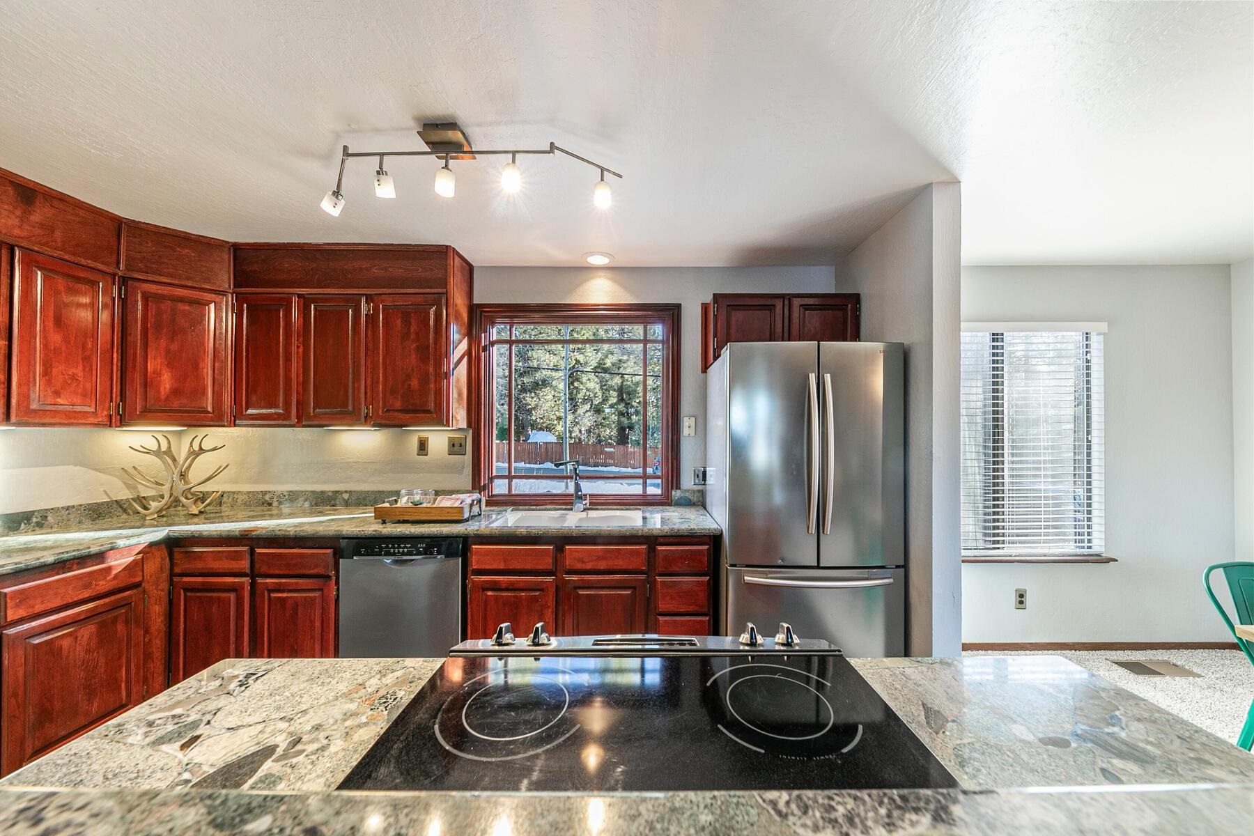 10806 Manchester Drive Truckee, CA 96161 - Photo 8 of 28 a kitchen with a sink stainless steel appliances and cabinets