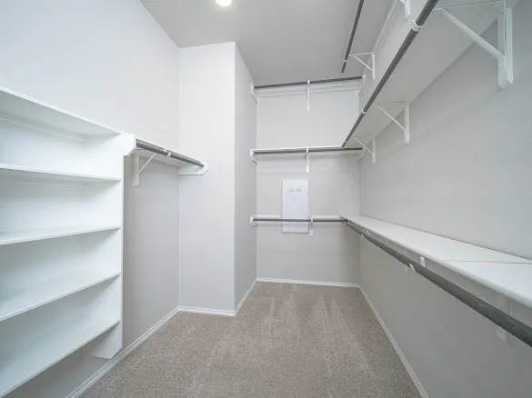 a view of an empty walk in closet