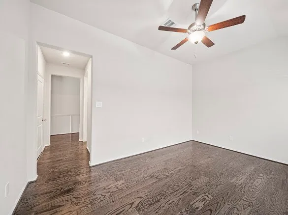 a view of a room with wooden floor