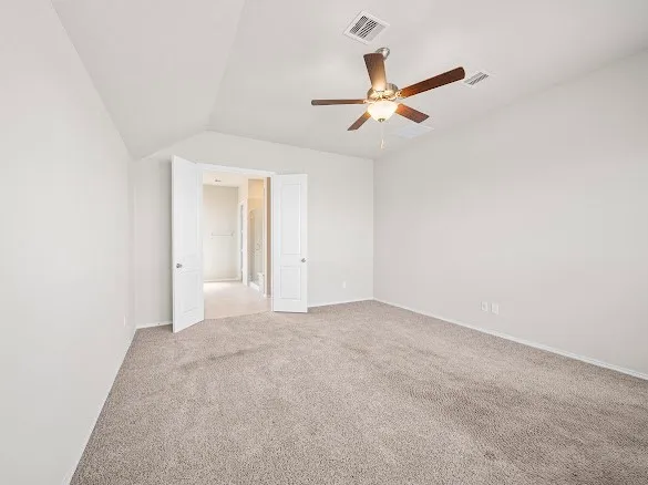 a view of a livingroom with a ceiling fan and window