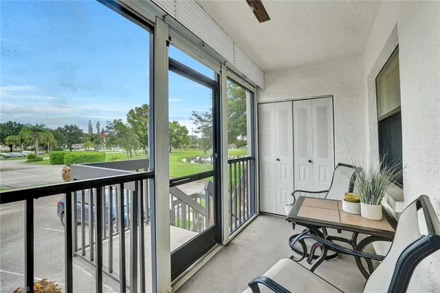 a view of a balcony with chairs