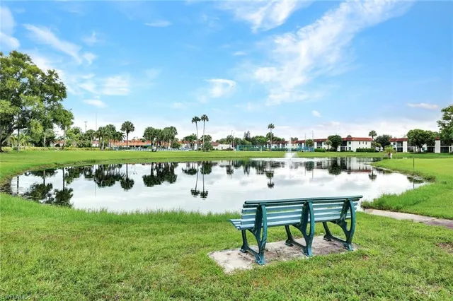 a view of a lake with a bench and a lake view