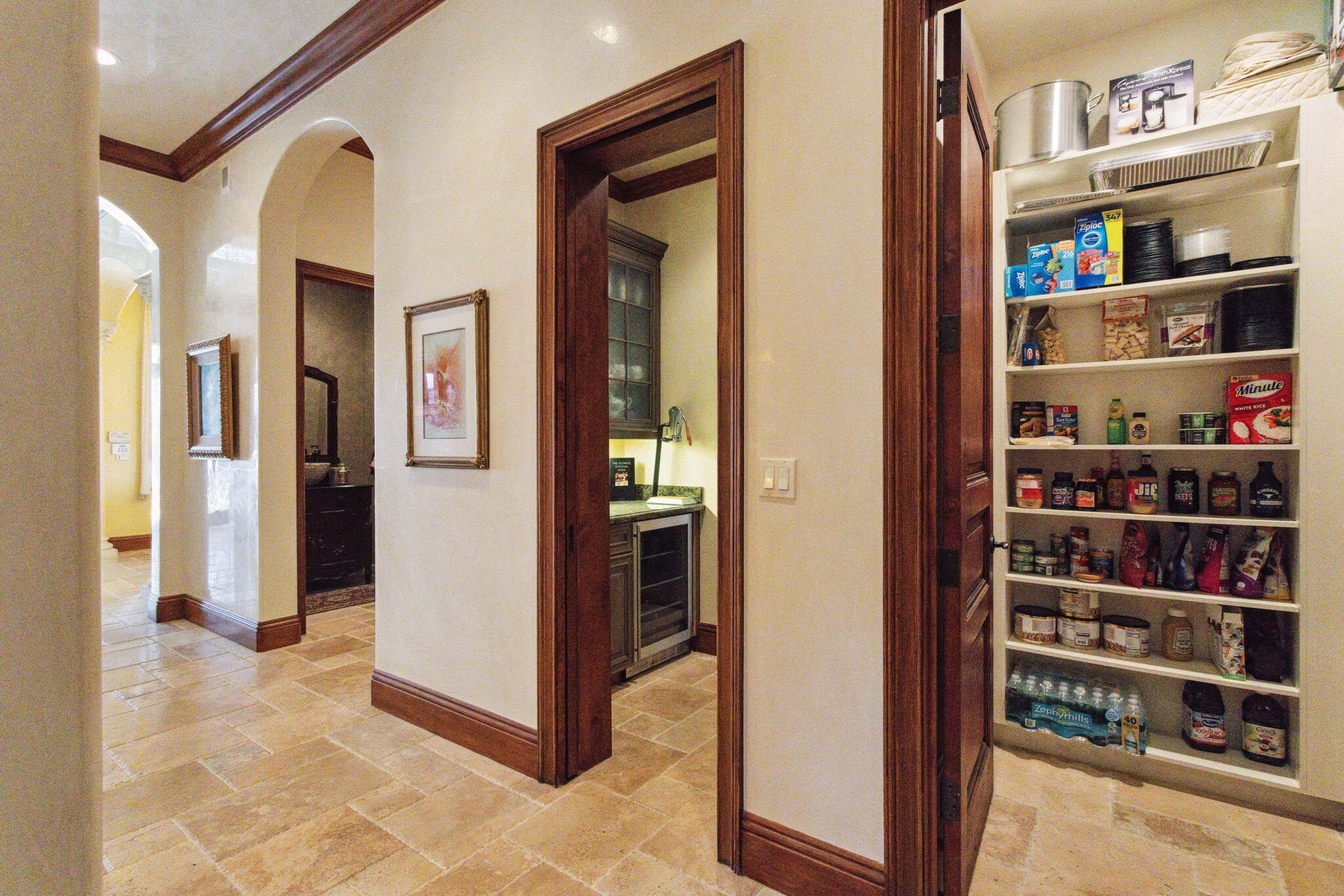 3870 Northeast 31st Avenue Lighthouse Point, FL 33064 - Photo 32 of 151 a view of a hallway with wooden shelves