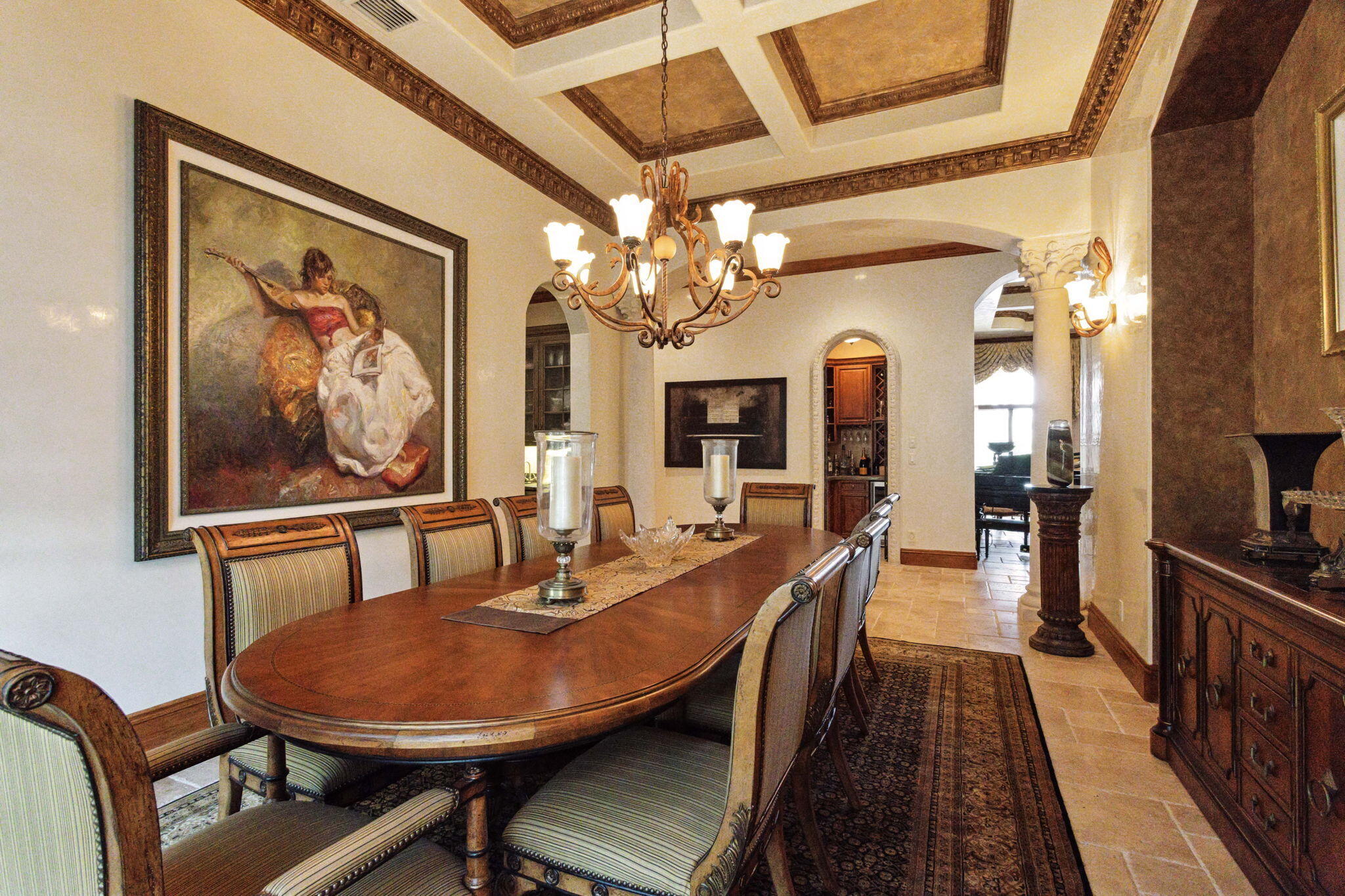 3870 Northeast 31st Avenue Lighthouse Point, FL 33064 - Photo 42 of 151 a dining room with wooden floor a chandelier a wooden table and chairs