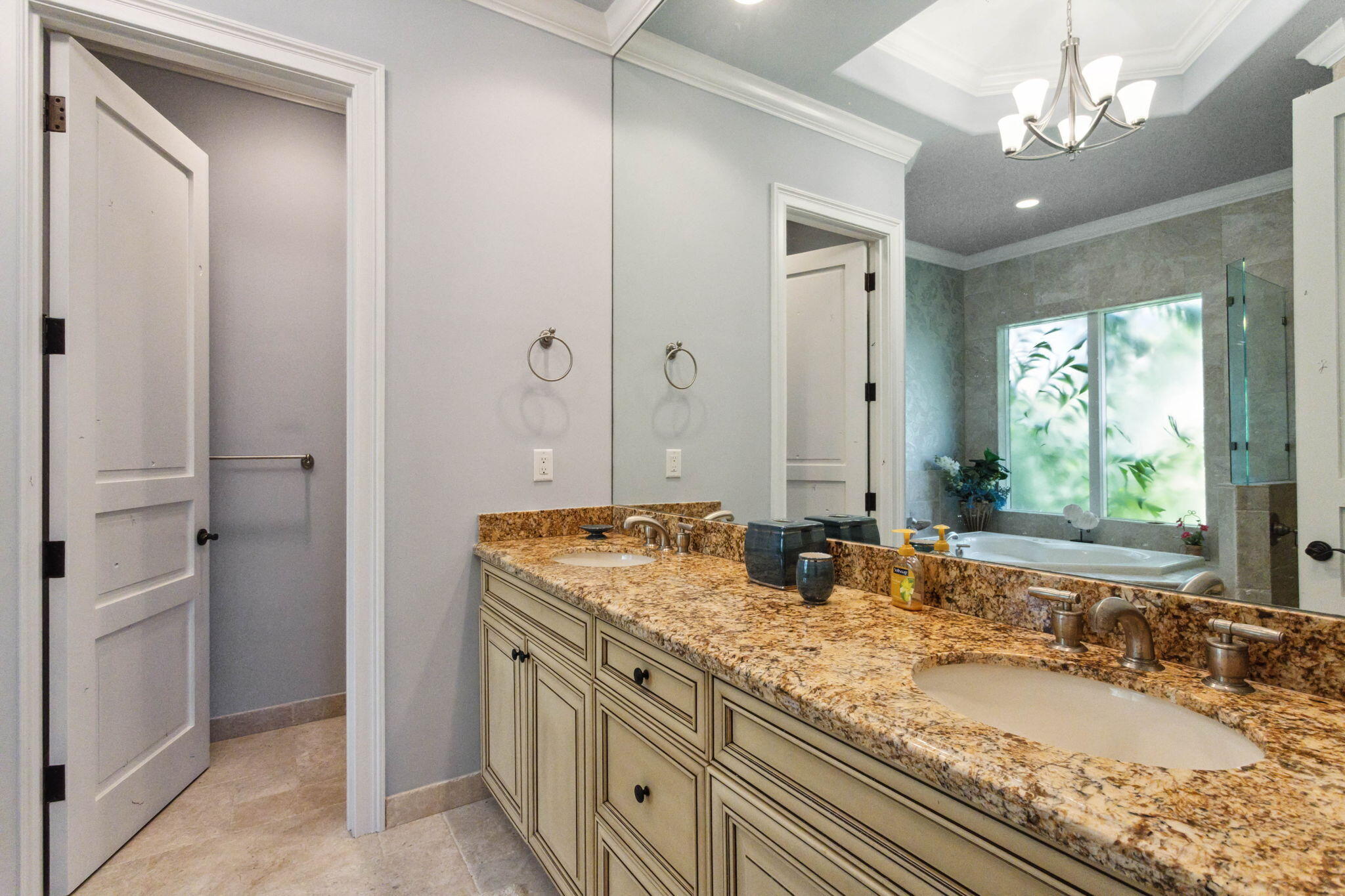 3870 Northeast 31st Avenue Lighthouse Point, FL 33064 - Photo 76 of 151 a bathroom with a granite countertop double vanity sink a mirror and a shower