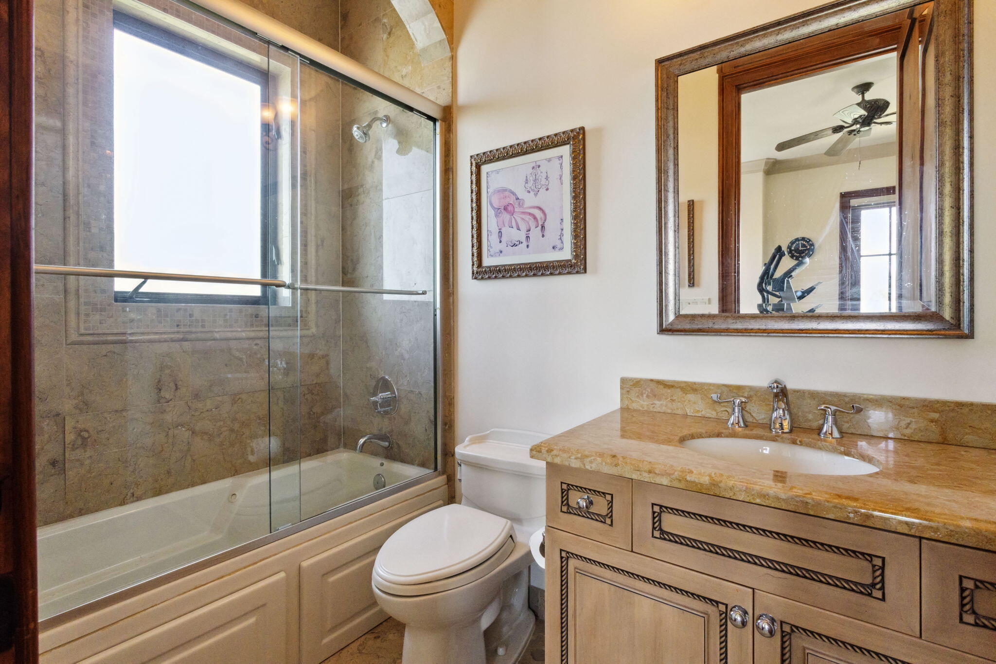 3870 Northeast 31st Avenue Lighthouse Point, FL 33064 - Photo 94 of 151 a bathroom with a granite countertop toilet a sink and a bathtub