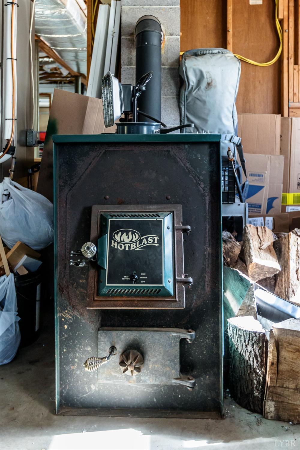 4945 Hixburg Road Pamplin, VA 23958 - Photo 24 of 27 a front view of a fireplace with exposed radiator