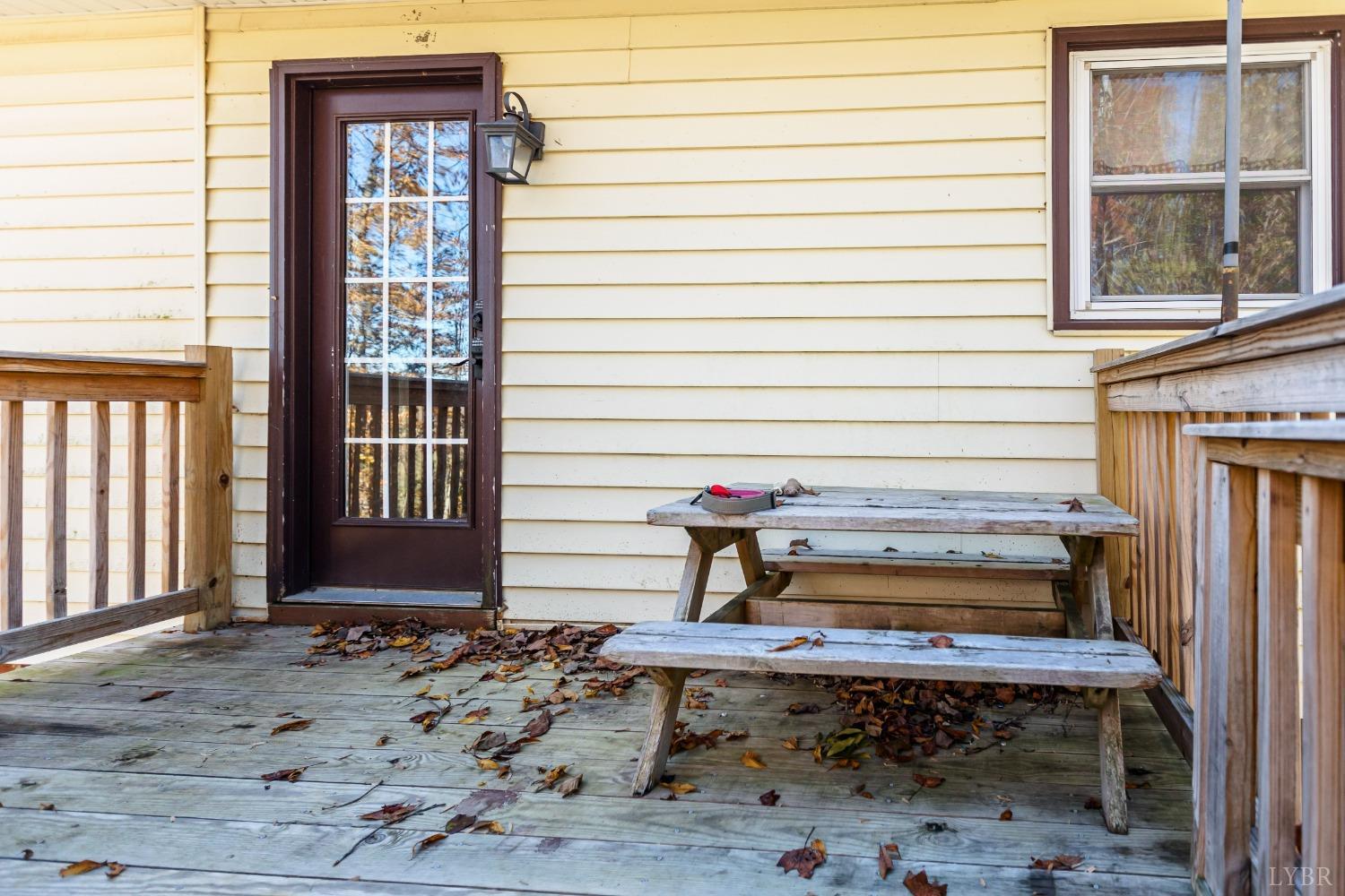 4945 Hixburg Road Pamplin, VA 23958 - Photo 25 of 27 a wooden bench sitting in front of a building