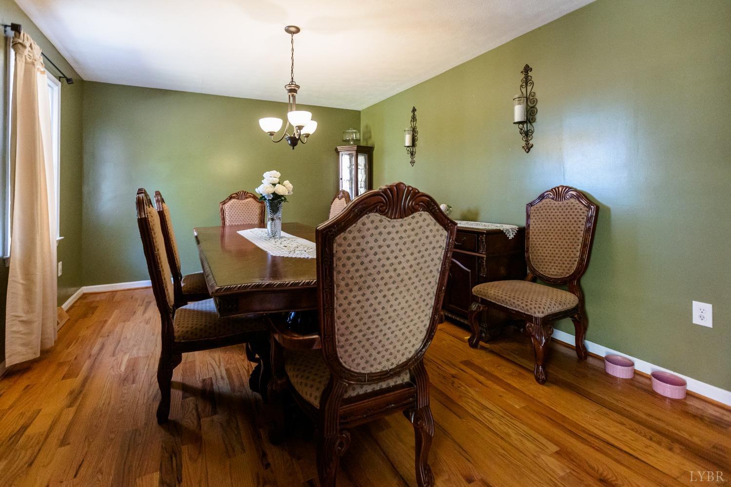 4945 Hixburg Road Pamplin, VA 23958 - Photo 9 of 27 a view of a dining room with furniture and wooden floor