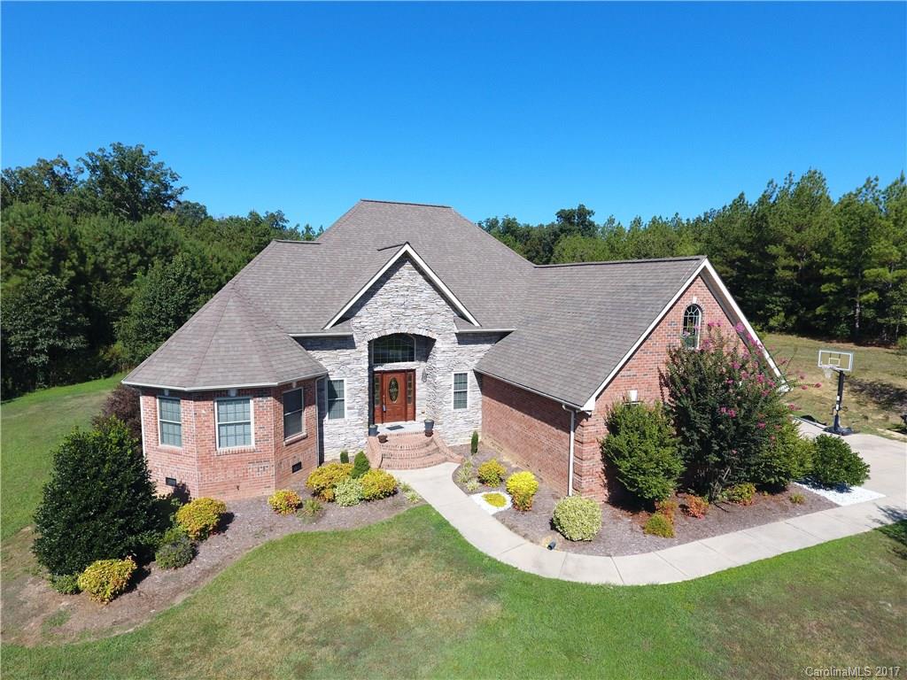 735 Faulkner Road Peachland, NC 28133 - Photo 1 of 24 a front view of a house with a yard