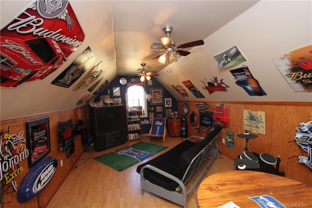 735 Faulkner Road Peachland, NC 28133 - Photo 14 of 24 a room with lots of different colored cloths