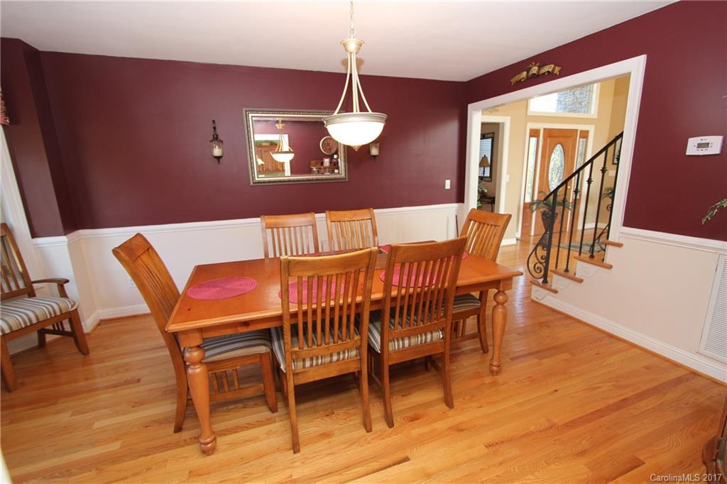 735 Faulkner Road Peachland, NC 28133 - Photo 7 of 24 a view of a dining room with furniture and wooden floor
