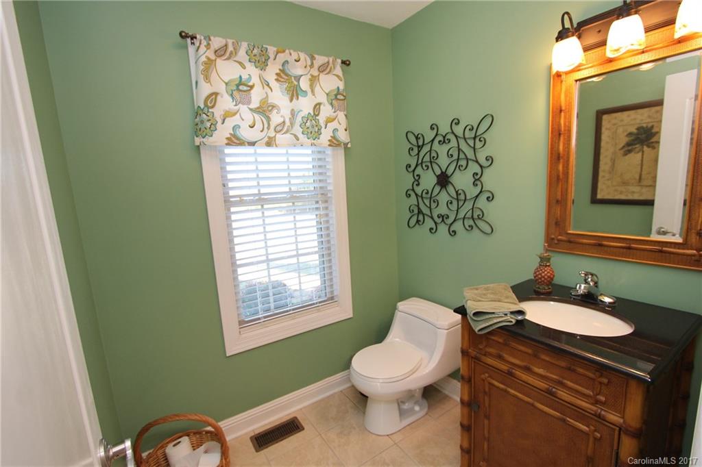 735 Faulkner Road Peachland, NC 28133 - Photo 9 of 24 a bathroom with a toilet sink and mirror