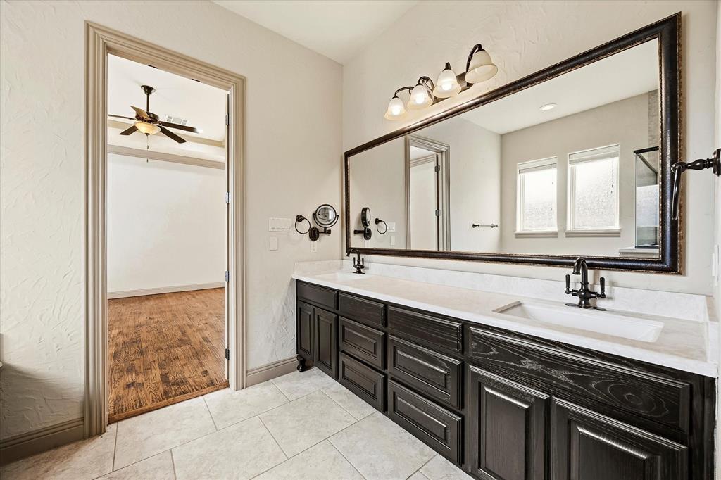 647 Gillon Way Rockwall, TX 75087 - Photo 24 of 40 Mater bath includes his and her vanities and custom cabinetry