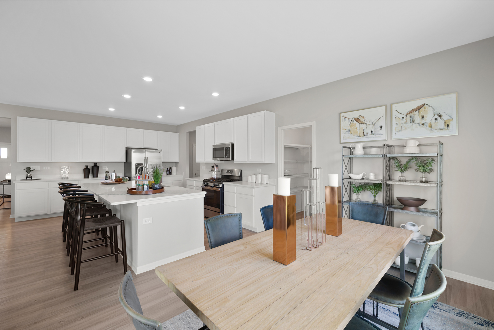 594 Lismore Circle Elgin, IL 60124 - Photo 8 of 20 a kitchen with a dining table chairs and refrigerator