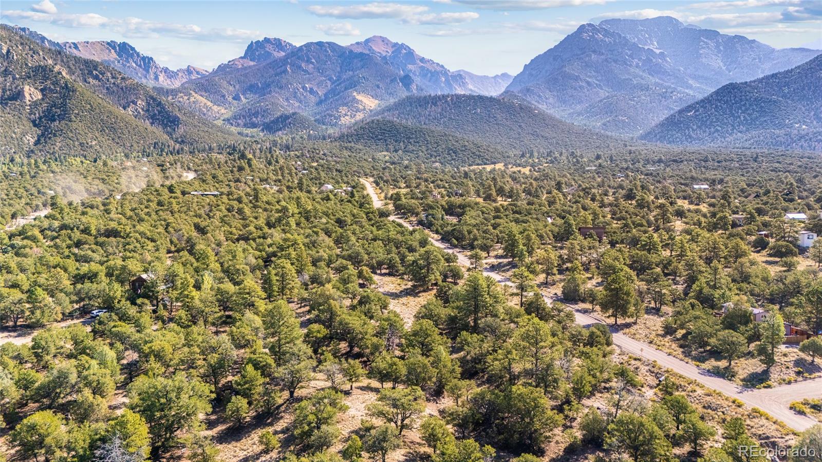 961 Ridgeview Way Crestone, CO 81131 - Photo 11 of 18 a view of a large building with a mountain in the background