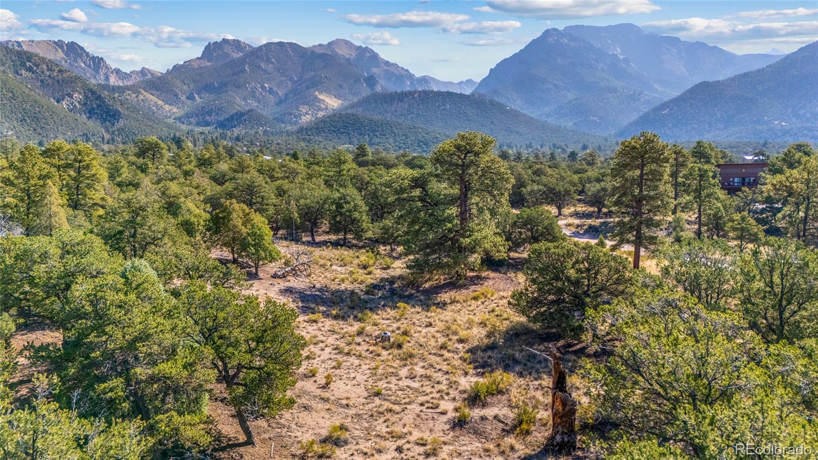 961 Ridgeview Way Crestone, CO 81131 - Photo 12 of 18 a view of a house with a mountain and a forest