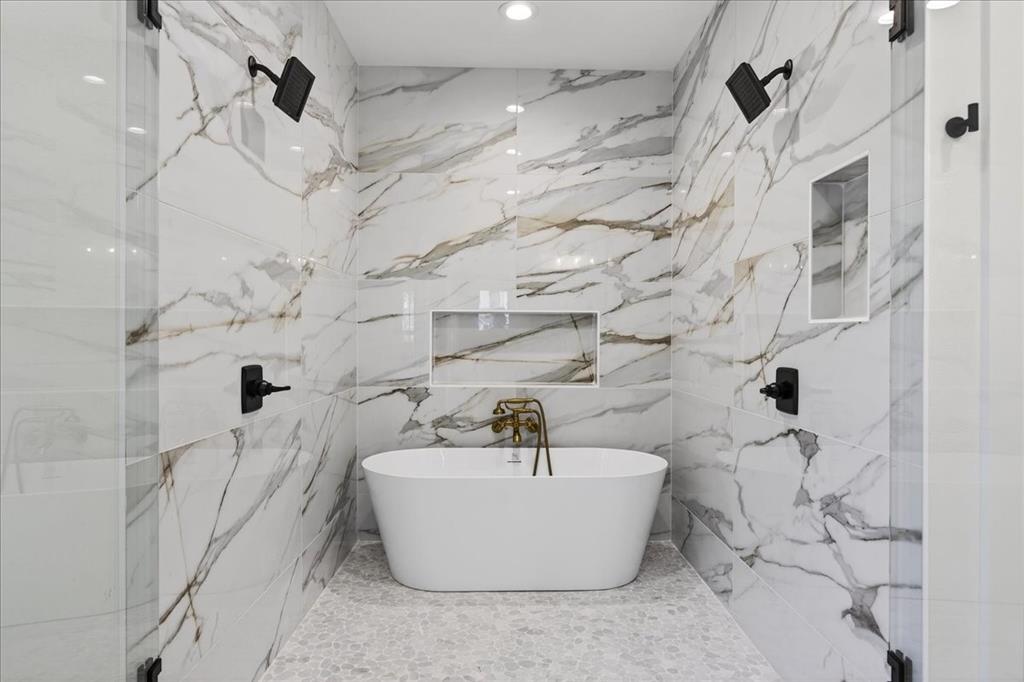 114 Castlewood Road Enchanted Oaks, TX 75156 - Photo 20 of 33 a white bath tub sitting in a bathroom and shower