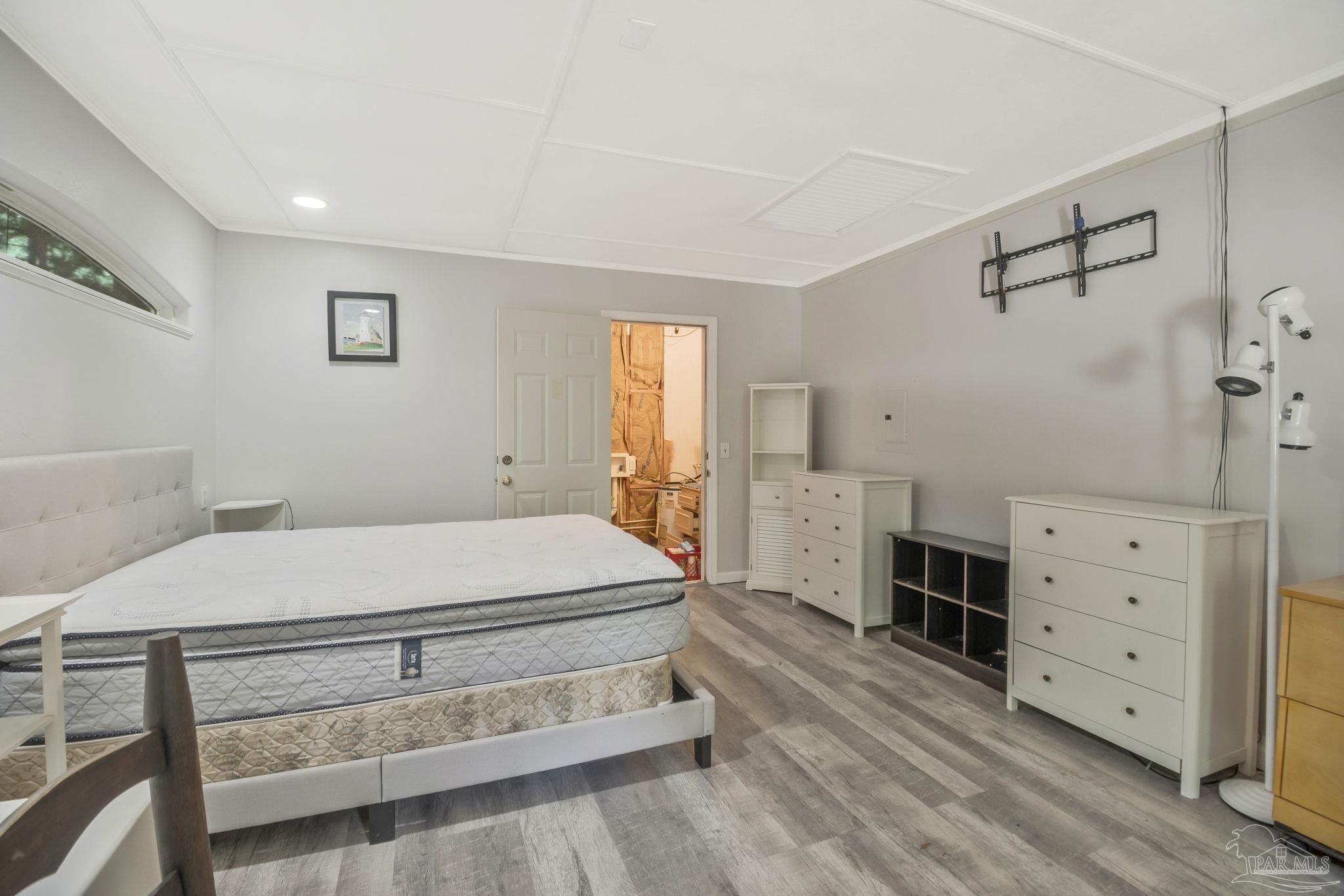 10290 West Lake Road Milton, FL 32583 - Photo 11 of 53 a bedroom with a bed and a dresser