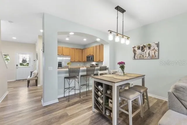 a view of kitchen with cabinets and wooden floor