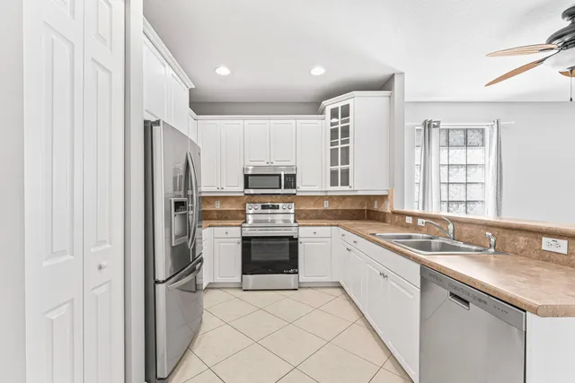 a kitchen with a cabinets and window