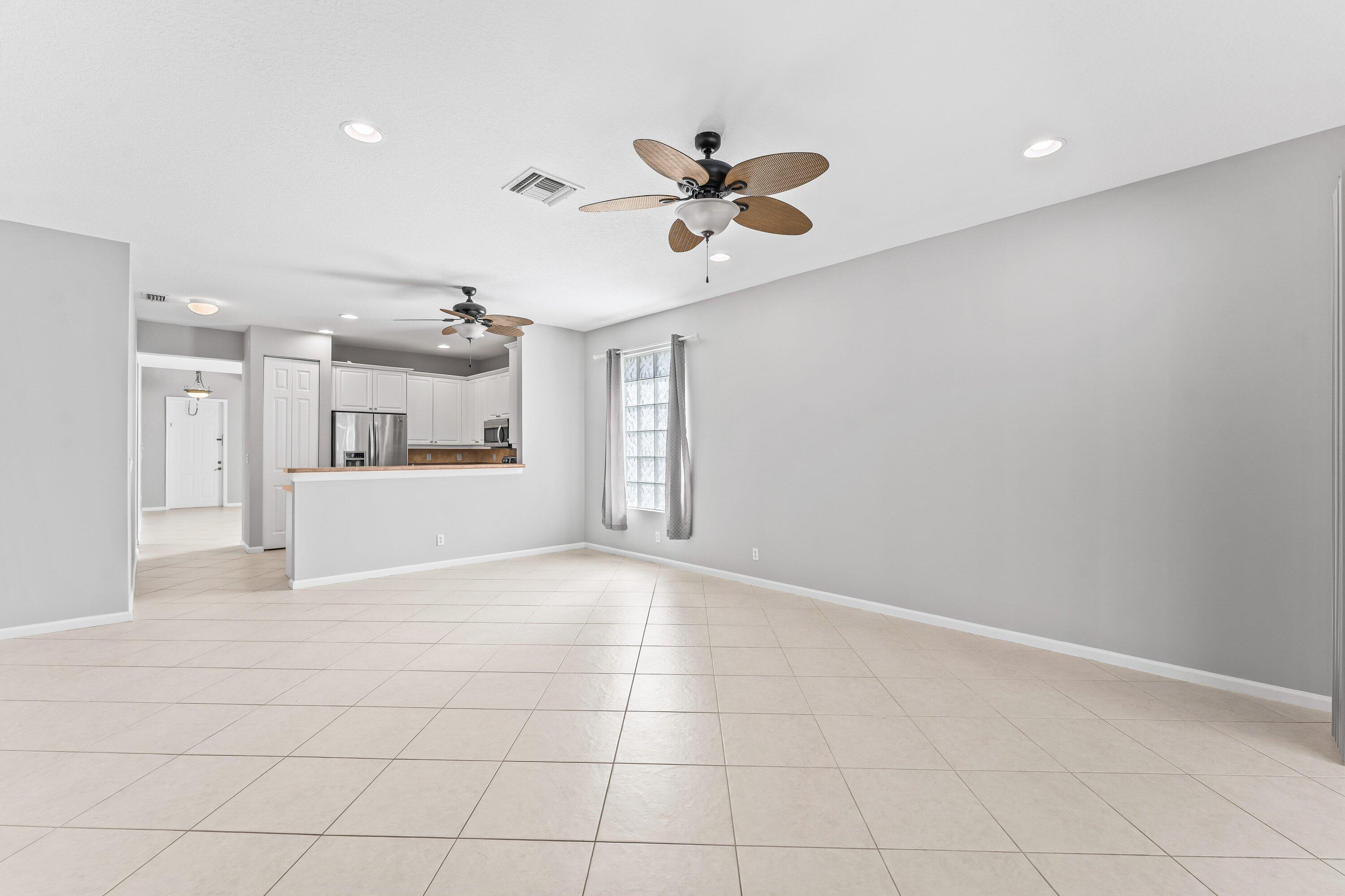 443 Belle Grove Lane West Palm Beach, FL 33411 - Photo 16 of 29 a view of a kitchen with a sink and a window