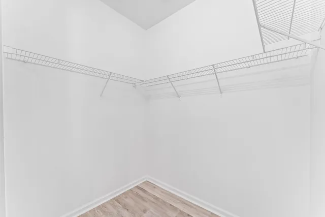 a bathroom with a double vanity sink mirror and bathtub