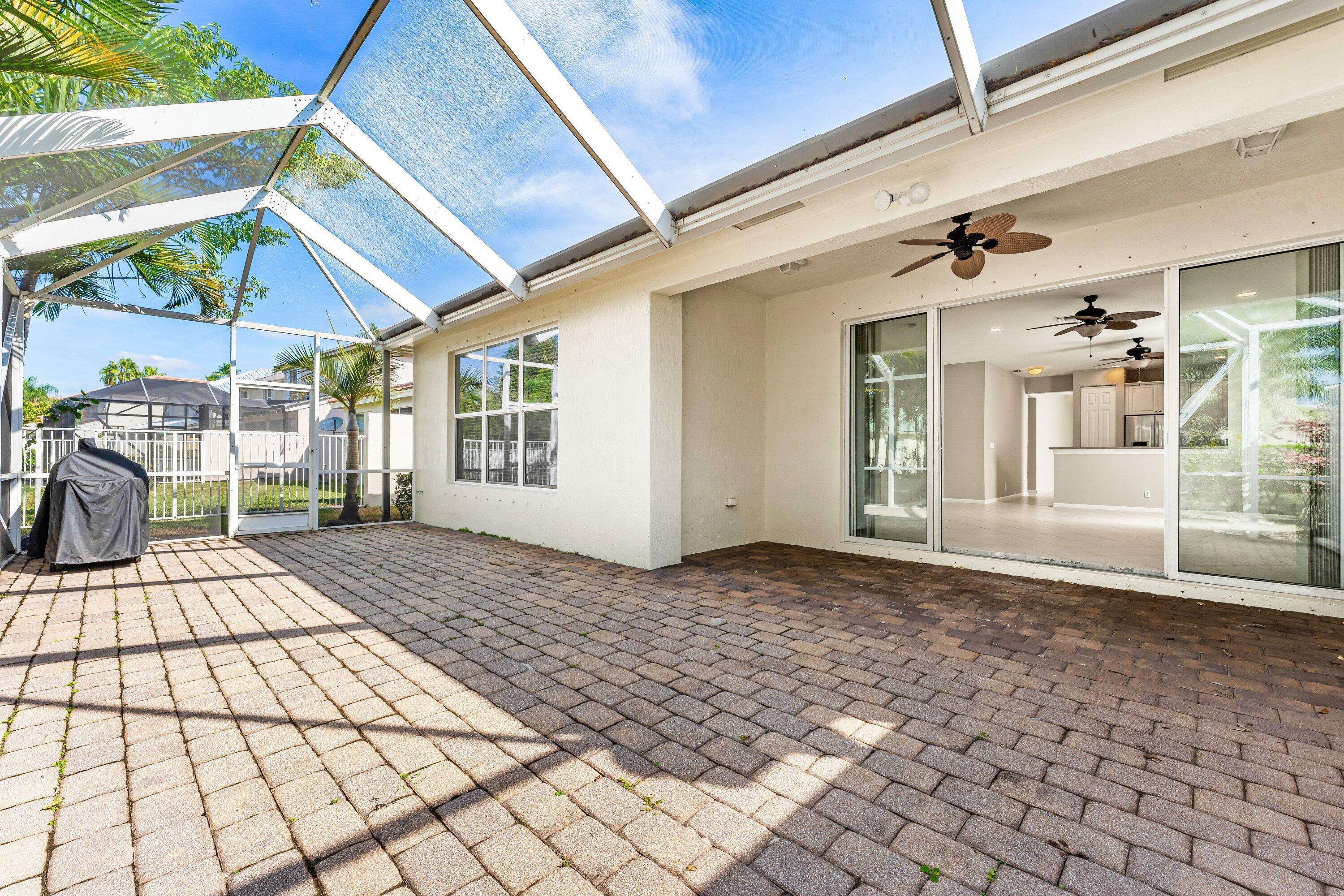 443 Belle Grove Lane West Palm Beach, FL 33411 - Photo 28 of 29 a view of a house with a porch