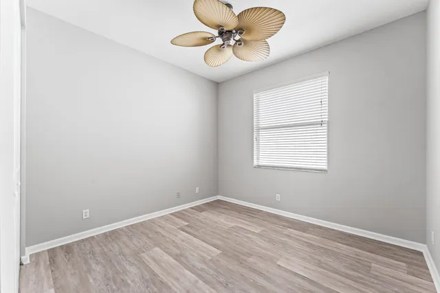 a view of a room with wooden floor