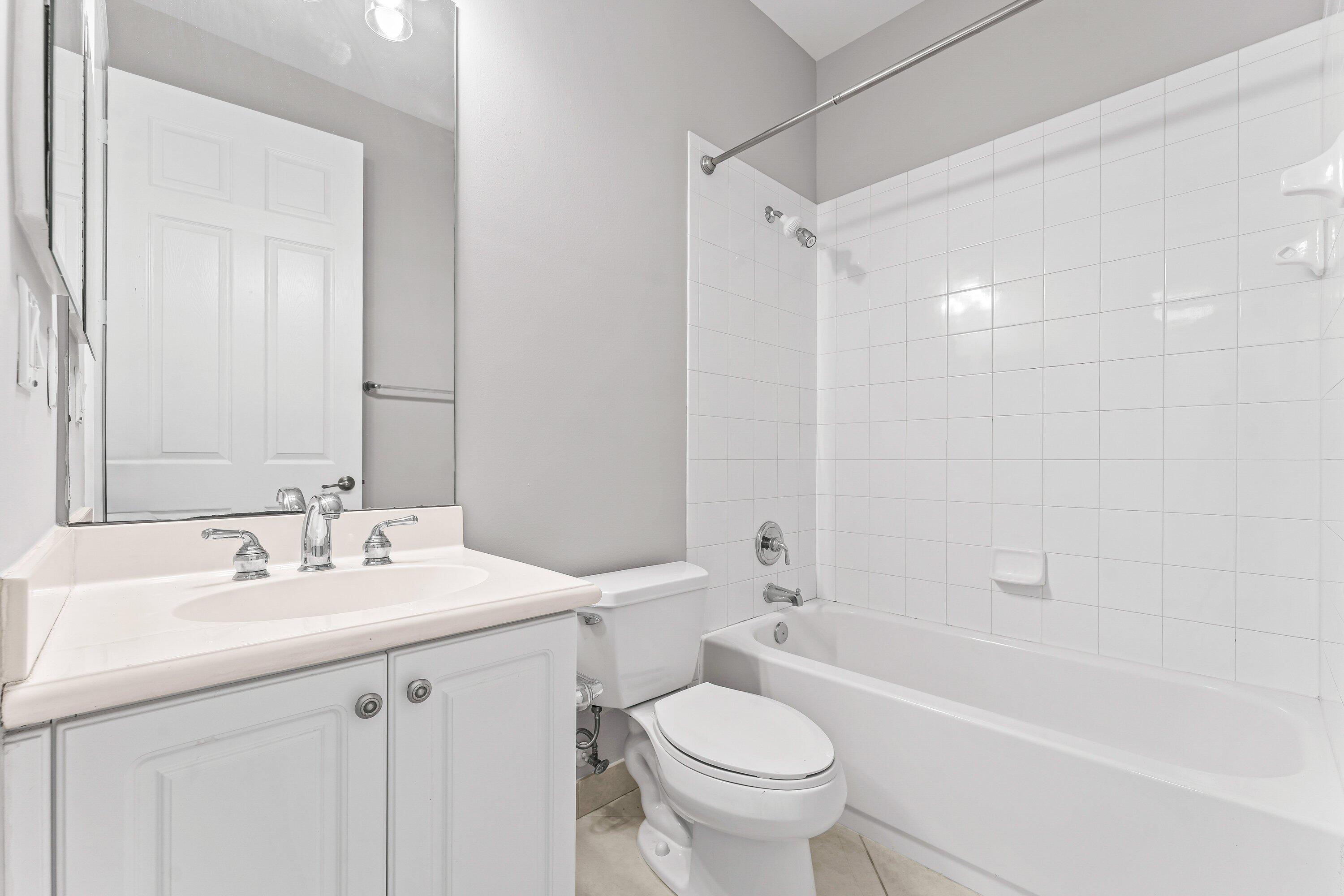 443 Belle Grove Lane West Palm Beach, FL 33411 - Photo 10 of 29 a bathroom with a sink toilet vanity and bathtub